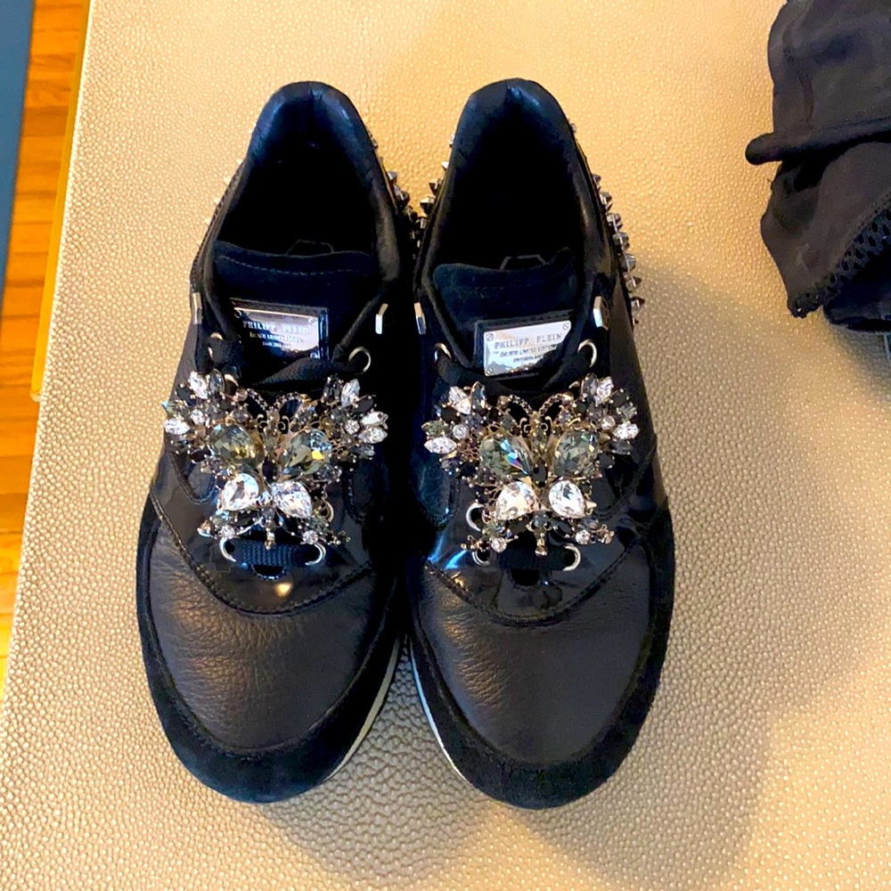 Phillip Plein studded sneakers with crystal butterfly detailing.